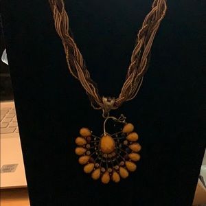 Yellow peacock with beautiful braided chain